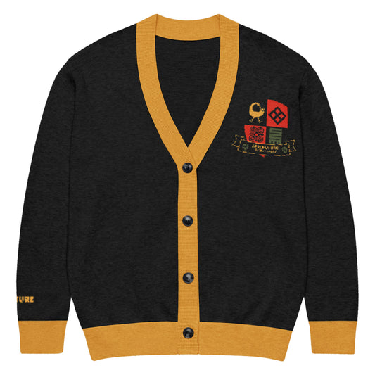 Black cardigan with yellow trim and embroidered designs on a white background