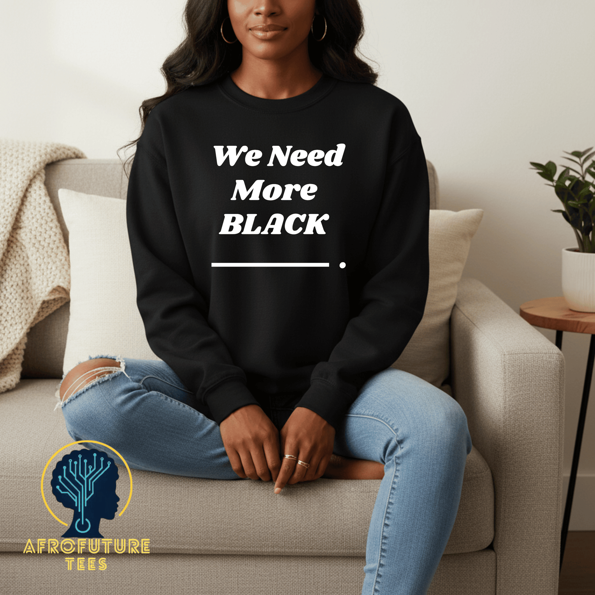 Model wearing the We Need More Black crewneck sweatshirt in black, featuring a bold statement design from the We Need More Black Collection.